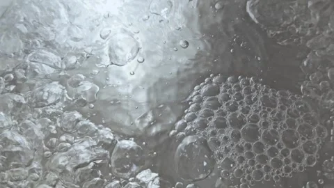 Surface of boiling water with many bubbles forming. Stock Footage 265763655