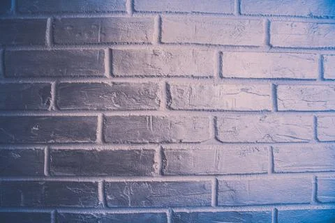The surface of the brickwork is painted blue Stock Photos