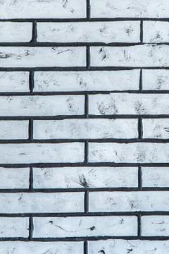 The surface of the brickwork is painted white Stock Photos