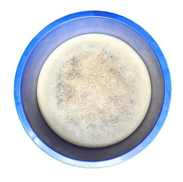 Surface of bubbles or lathers cover dirty water in blue container Stock-Fotos