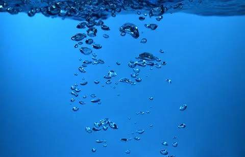 Surface Bubbles under Blue water back ground Copy space Stock Photos