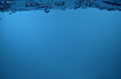 Surface Bubbles under Blue water back ground Copy space Stock Photos