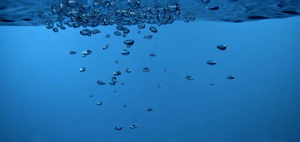 Surface Bubbles under Blue water back ground Copy space Stock Photos