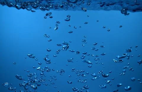 Surface Bubbles under Blue water back ground Copy space Stock Photos