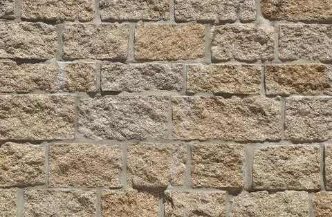 Surface built in stone blocks, natural irregular texture Stock Photos