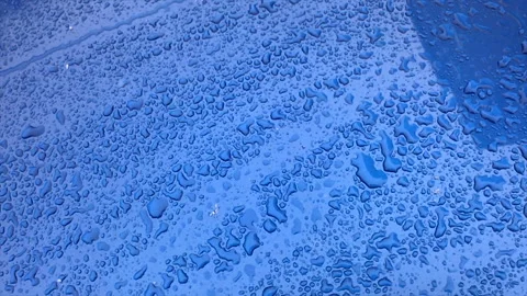Surface of the car and slowly falling snow in winter day Stock Footage 99704601