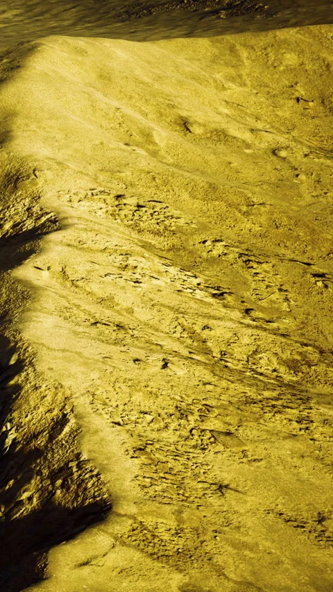 Surface of a celestial body shows yellow textures and patterns in space Stock Footage 334259155