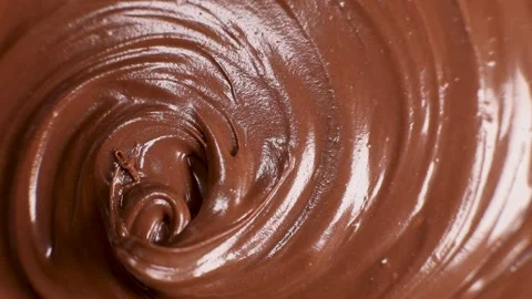 Surface of the chocolate nut butter rotates, close-up Stock Footage 230178984