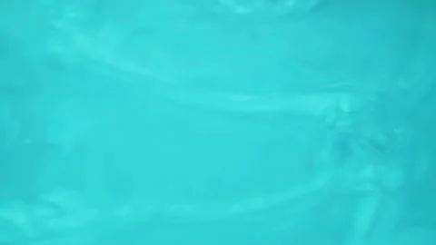 Surface of Clear Blue Water in Sunbeams, Ripples and Waves on Water, Pool, Sea,  Stock Footage 169575421