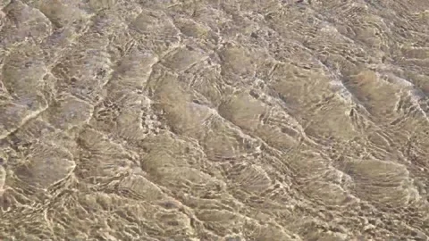 Surface of clear streaming river water with ripples Stock Footage 137767603