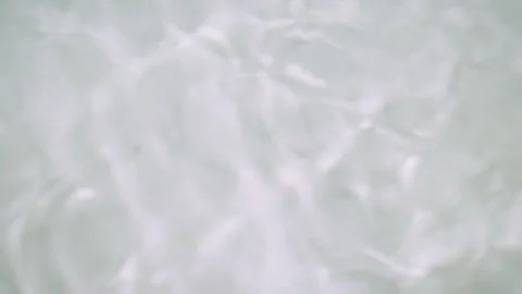 The surface of clear water with ripple waves in a white bathtub to water calm Stock Footage 266089903