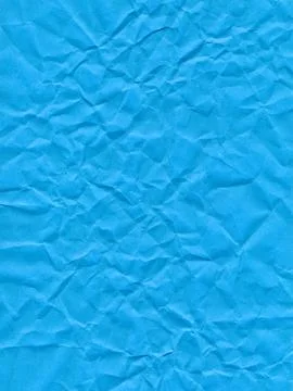 Surface of colored paper, sheet of crumpled blue paper Stock Photos