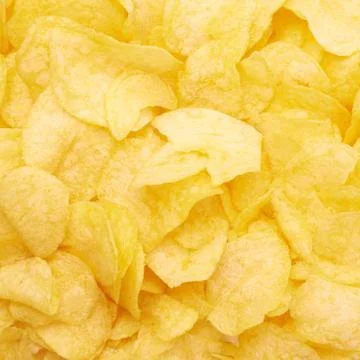 Surface covered with potato chips Stock Photos