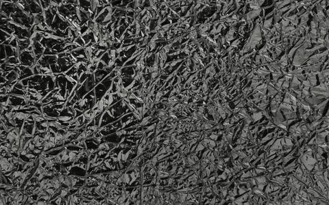 Surface of crumpled silver foil close-up Stock Photos