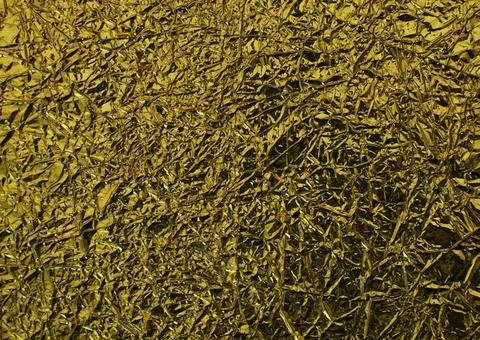 Surface of crumpled silver foil close-up. Stock Photos