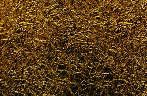 Surface of crumpled silver foil close-up. Stock Photos