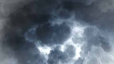 The surface of a dark cumulus cloud with lightning striking within it. Stock Footage 145889075