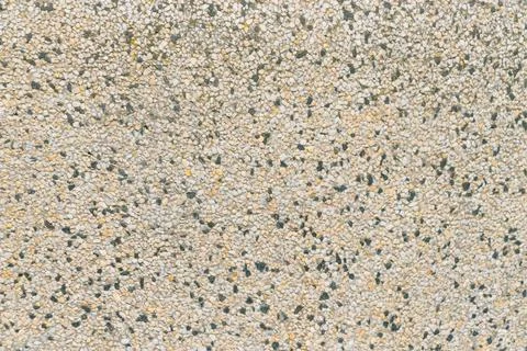 Surface decorated with small pebbles. Backgrounds Stock Photos