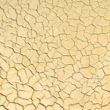 Surface of dried lake bed with cracks in mud, natural background Stock Photos