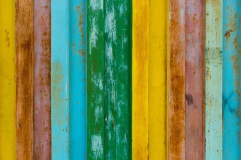 The surface of durable iron is painted with paint in different colors Stock Photos