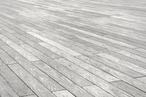 The surface with elongated rectangular stone tiles of gray color goes into di Stock Photos