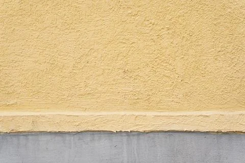The surface of the end of the stone house is made of two colors of yellow and Stock Photos