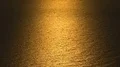 Surface of endless rippling sea in golden light of sunset glow, beautiful nature HD Footage