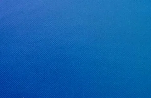 The surface of the fabric is blue in close-up. Stock Photos