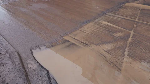 Surface features of resurfaced tarmac, Visual analysis of tarmac patch with Stock Footage 319197934