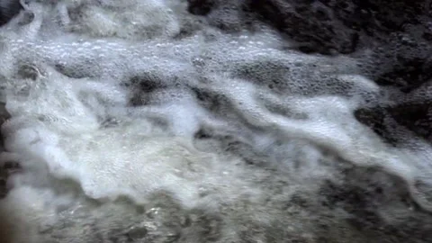 The surface of the foamed water in the stream Stock Footage 142279102