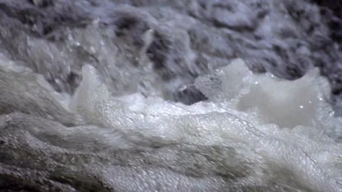 The surface of the foamed water in the stream Stock Footage 142279240