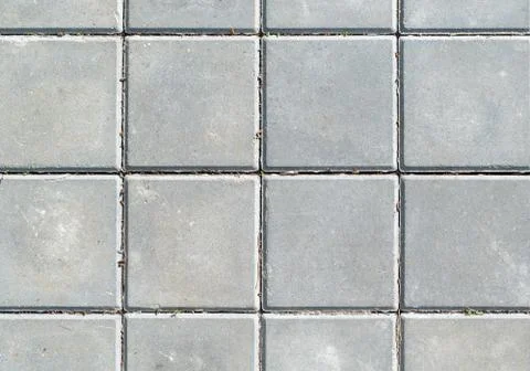 Surface of the gray square concrete slabs Stock Photos
