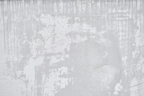 The surface of the gray wall is stained with wet spots. The stone texture of the Stock Photos