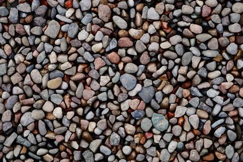 The surface of the ground is full of medium- and small-sized multi-colored st Stock Photos