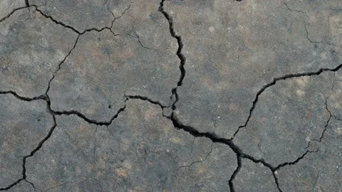 Surface of a grungy dry cracking parched earth for textural background. Video stock 140781953