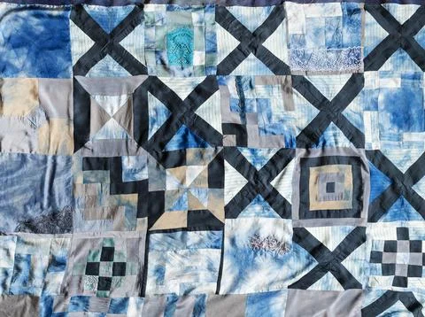 Surface of hand-sewn silk patchwork quilt Fotos de archivo