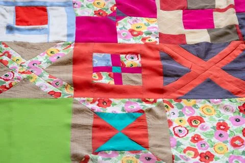 Surface of hand-stitched colorful patchwork cloth Stock Photos