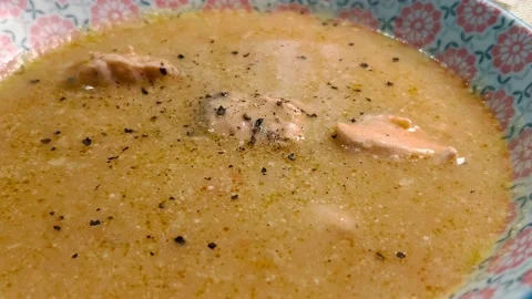 The surface of a hot fish soup with pieces of fish in a bowl. Stock Footage 234549873