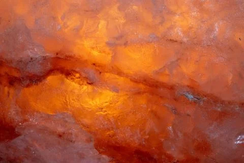 Surface of iluminated Himalayan salt stone. Macro photo. Stock Photos
