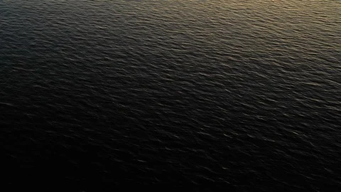 Surface of a lake at sunset Stock Footage 124412985