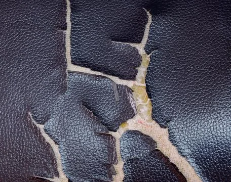 Surface of leatherette on the sofa is damaged Stock Photos