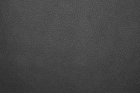 The surface is made of black matte leather. Stock Photos