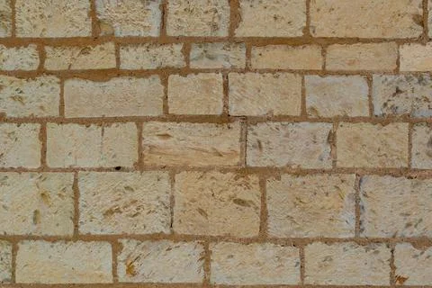 Surface made of regular rectangular stone blocks 스톡 사진