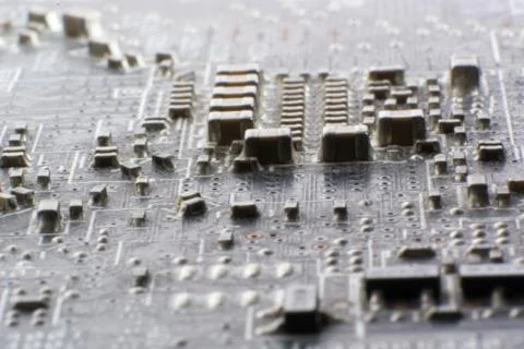 Surface-mount dusty smd components on used electronic circuit board. Stock Photos