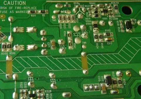 Surface mount electronic circuit board close up with components traces 스톡 사진