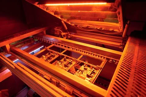 Surface mounting process of printed circuit boards during reflow soldering in a Stock Photos