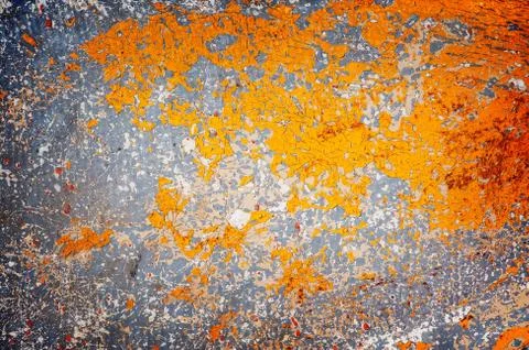 Surface with multicolored paint flaking and cracking background texture Stock Photos
