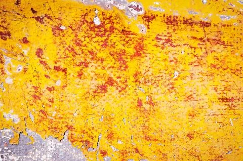 Surface with multicolored paint flaking and cracking background texture Stock Photos