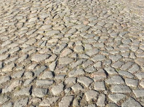 Surface of an old cobblestone road Foto stock