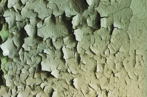 A surface with an old cracked paint splitting large pieces Stock Photos